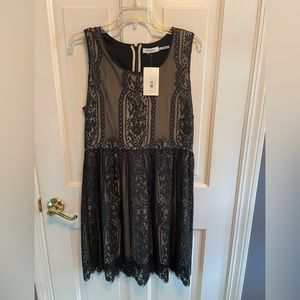 Brand New With Tags. Black Lace Dress Size Large. Retails $56.